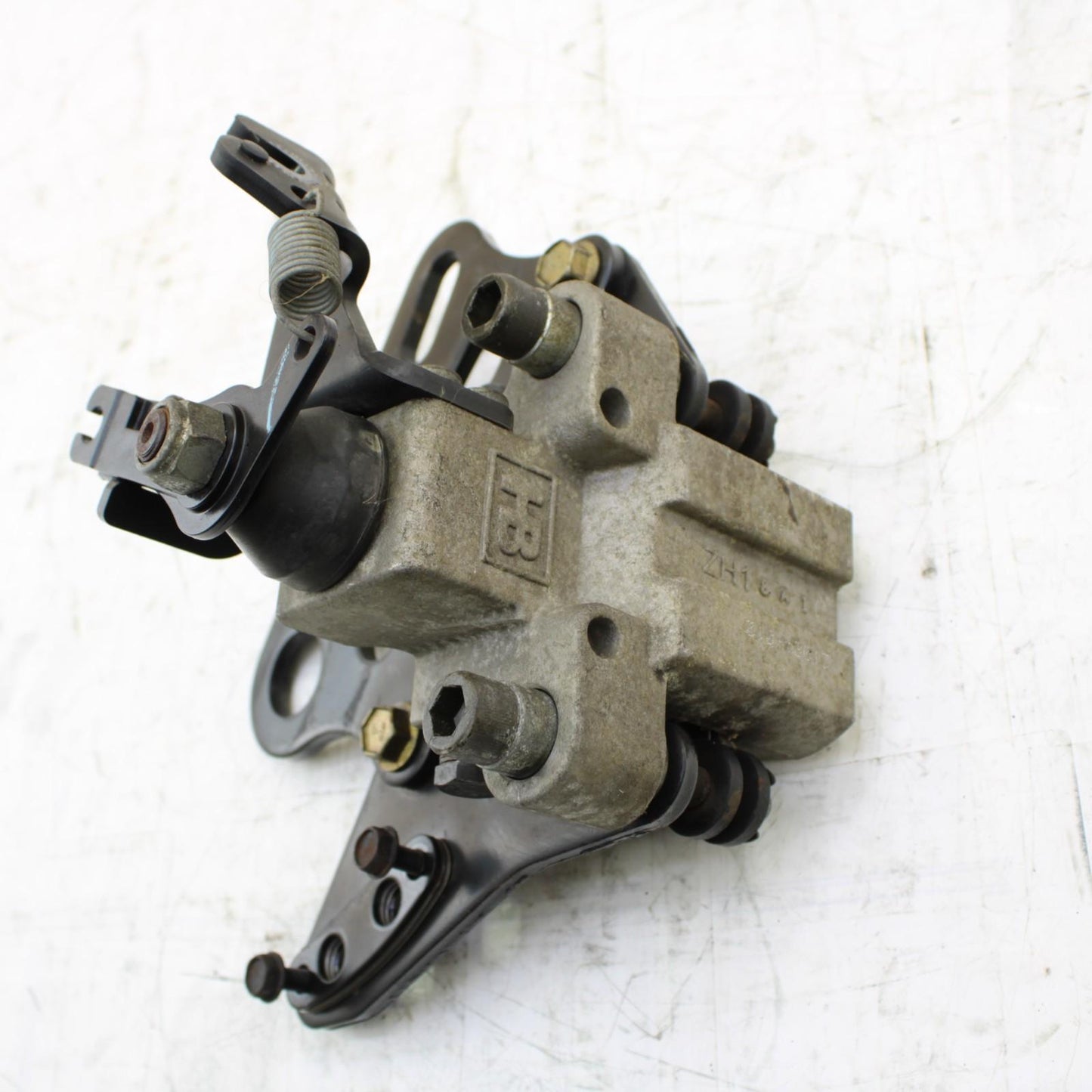 2008 CAN-AM SPYDER REAR BRAKE CALIPER W/ PARKING BRAKE MOUNT BRACKET