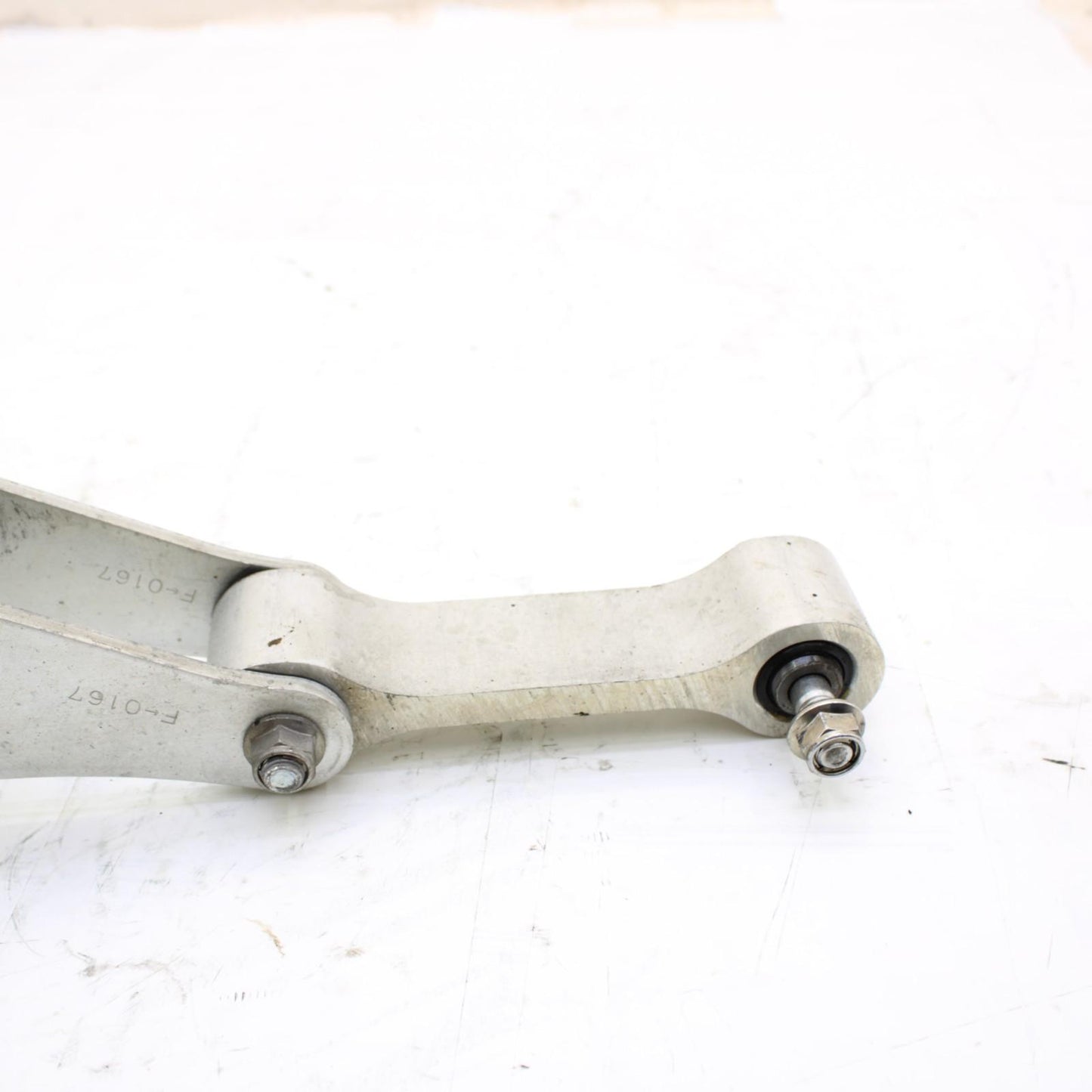 2011 - 2015 KAWASAKI NINJA ZX10R DOG BONE REAR SHOCK LINKAGE SILVER STOCK OEM