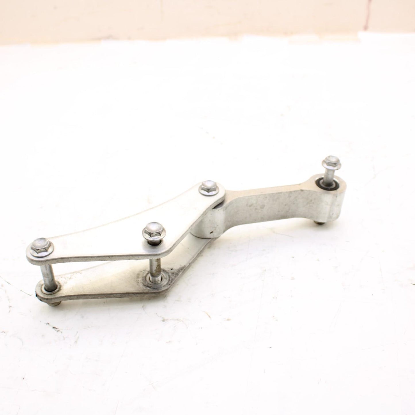 2011 - 2015 KAWASAKI NINJA ZX10R DOG BONE REAR SHOCK LINKAGE SILVER STOCK OEM
