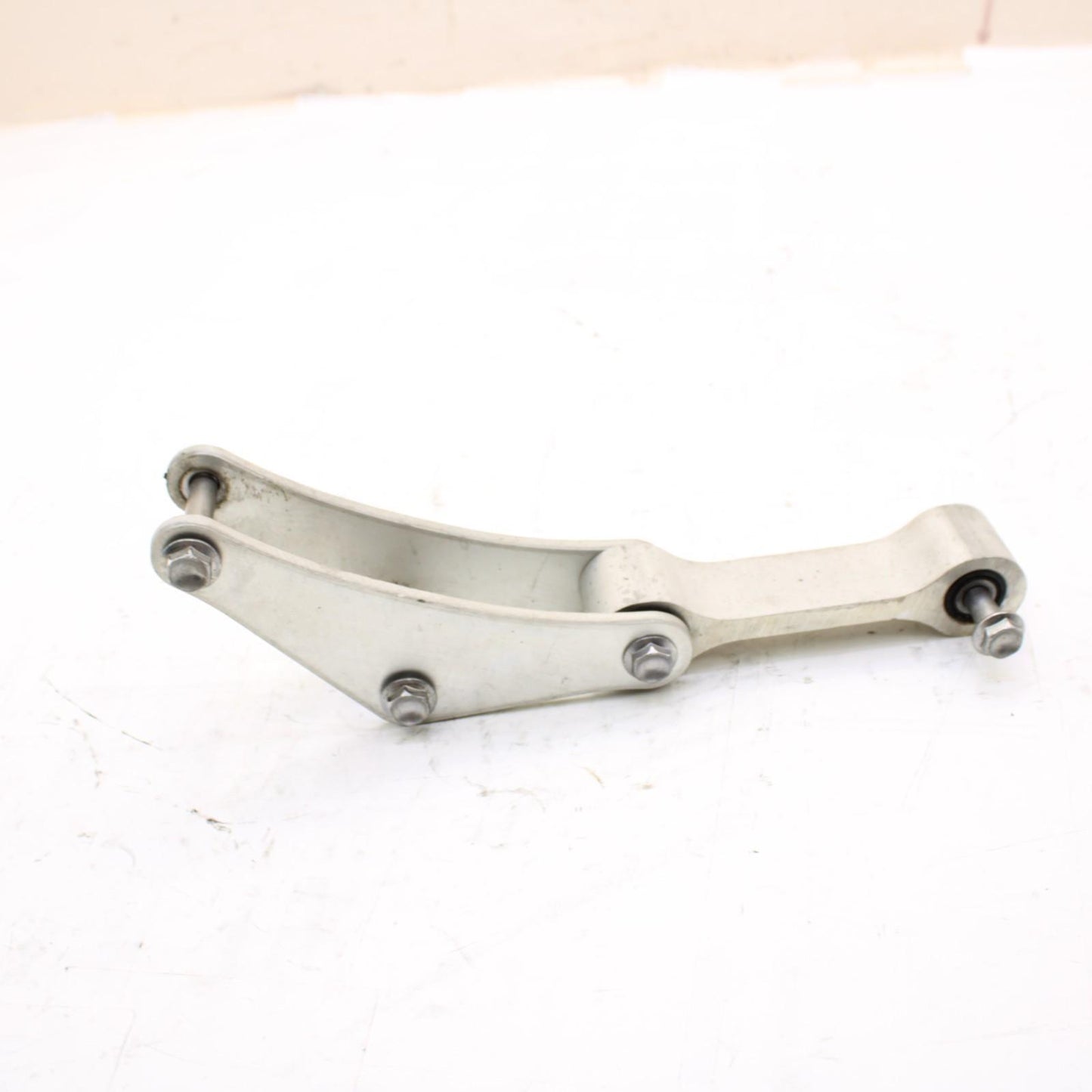 2011 - 2015 KAWASAKI NINJA ZX10R DOG BONE REAR SHOCK LINKAGE SILVER STOCK OEM