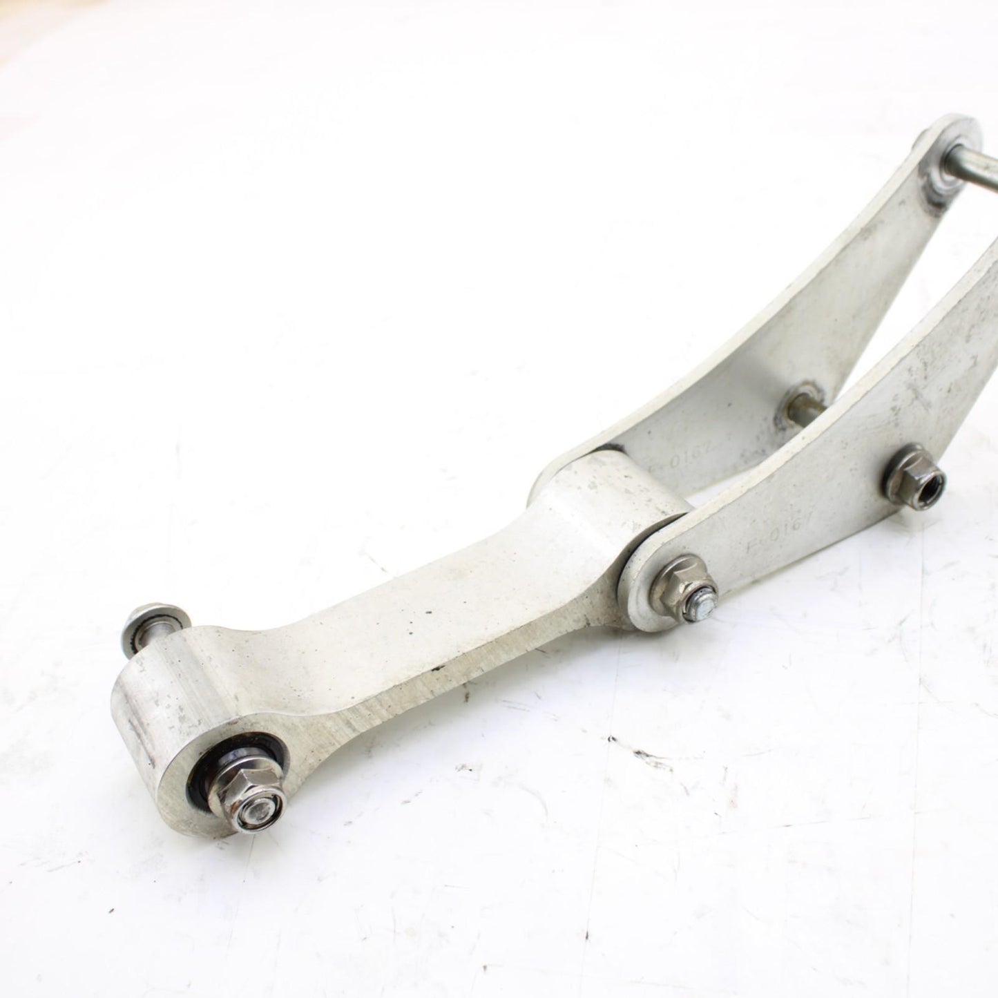 2011 - 2015 KAWASAKI NINJA ZX10R DOG BONE REAR SHOCK LINKAGE SILVER STOCK OEM